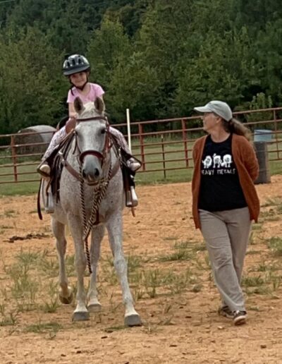 Beginner student in a lesson riding Silverhawk